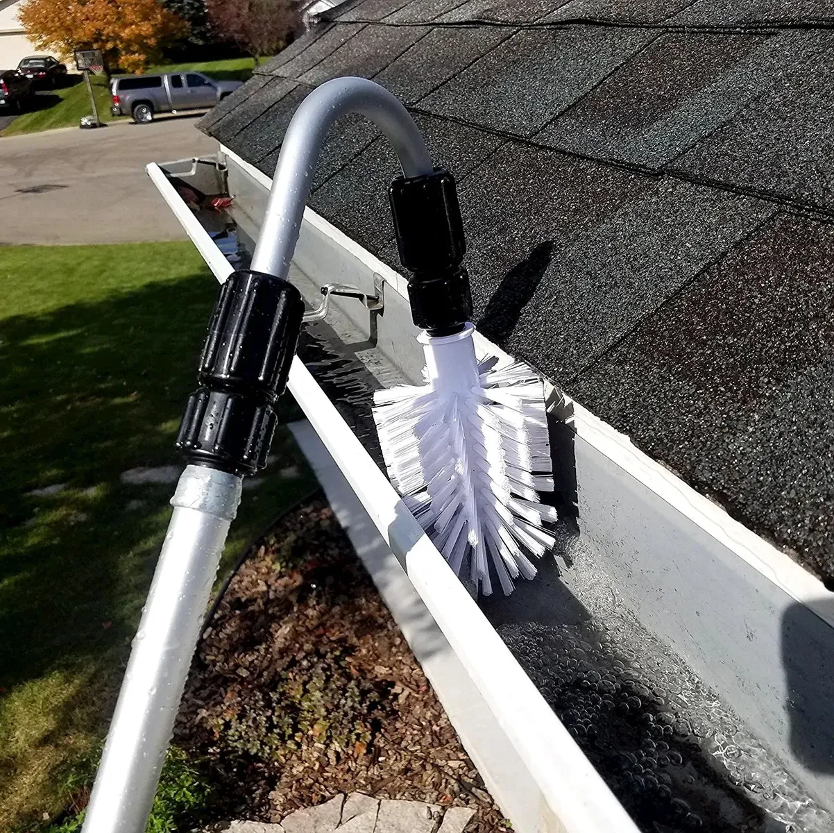 Gutter clear and downpipe flush on a Glanmire semi, half-full runs cleaned to the gullies after the moss scrape